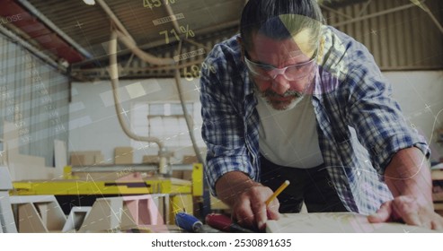Image of data processing over caucasian male carpenter working in workshop. Global communication, work and digital interface concept digitally generated image.