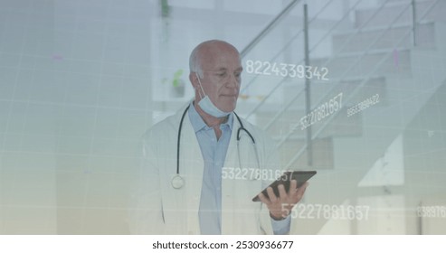 Image of data processing over caucasian male doctor with tablet. senior home hangout and digital interface concept digitally generated image.