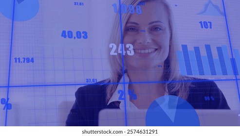 Image of data processing over caucasian businesswoman using laptop. Global finance, business, connections, computing and data processing concept digitally generated image.