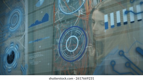 Image of data processing over caucasian woman inspecting server room. global technology and digital interface concept digitally generated image.