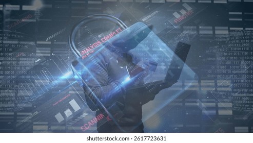 Image of data processing over caucasian male hacker using laptop. global business and digital interface concept digitally generated image.