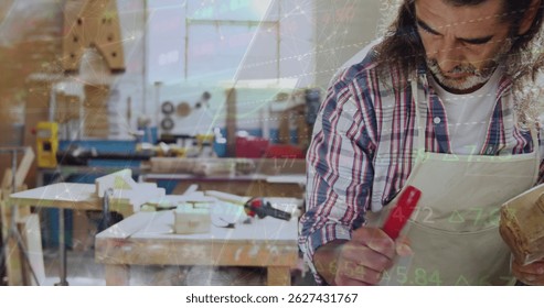 Image of data processing over caucasian male carpenter working in workshop. Global communication, work and digital interface concept digitally generated image. - Powered by Shutterstock - Get 15% off with code: PIKWIZARD15