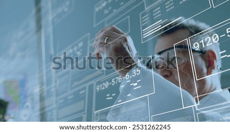 Image of data processing over caucasian male scientist working in lab. Global science, computing and digital interface concept digitally generated image.