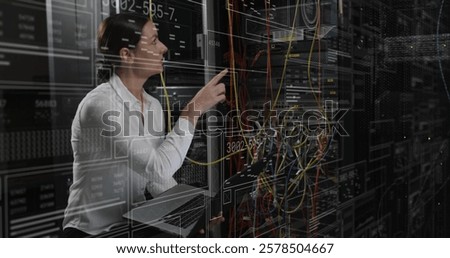 Image of data processing over caucasian female it technician with laptop over computer servers. Global connections, computing and data processing concept digitally generated image.