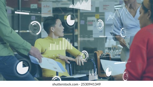 Image of data processing over disabled and diverse business people working in office. Global business and digital interface concept digitally generated image.