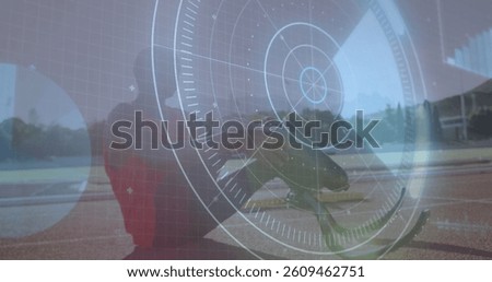 Image of data processing over disabled male athlete with running blades on racing track. global sports, disability and technology concept digitally generated image.