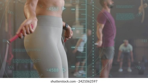 Image of data processing over diverse woman and man jumping rope cross training at gym. Fitness, exercise, strength, data, digital interface and technology digitally generated image. - Powered by Shutterstock - Get 15% off with code: PIKWIZARD15