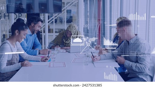 Image of data processing over diverse business people in office. Global business, digital interface, computing and data processing concept digitally generated image.