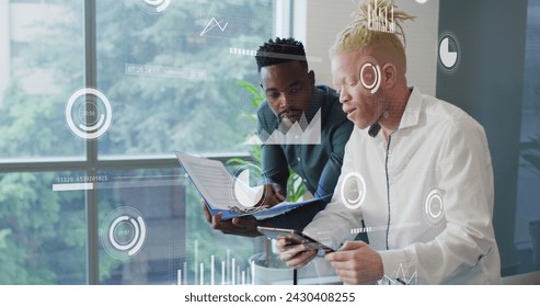 Image of data processing over diverse business people in office. Global business, finances, computing and data processing concept digitally generated image.