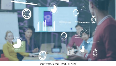 Image of data processing over diverse business people in office. Global business and digital interface concept digitally generated image.