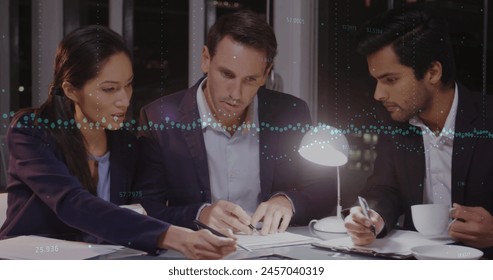 Image of data processing over diverse business people talking. global business and digital interface concept digitally generated image.