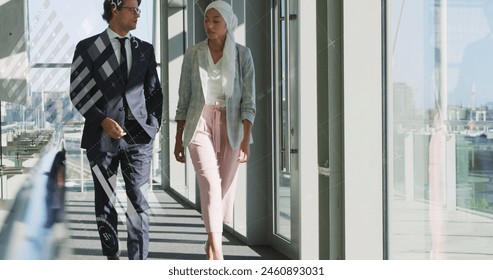 Image of data processing over diverse business people at office. Global business, computing and digital interface concept digitally generated image.