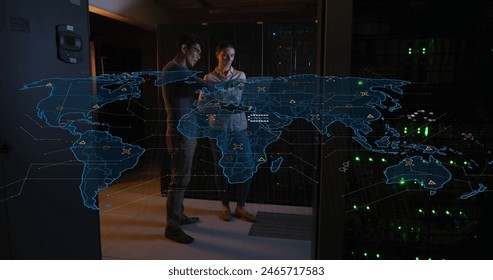 Image of data processing over diverse workers in server room. global business and digital interface concept digitally generated image.