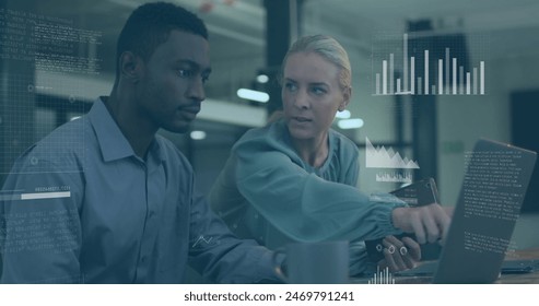 Image of data processing over diverse man and woman discussing over laptop at office. Computer interface and business technology concept