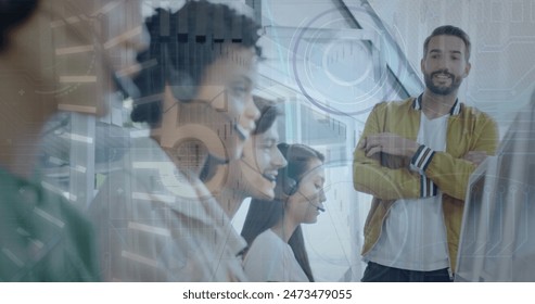 Image of data processing over diverse business people in office. Global business and digital interface concept digitally generated image.