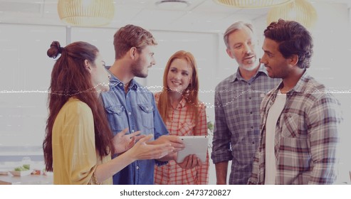 Image of data processing over diverse business people in office. Global business and digital interface concept digitally generated image.