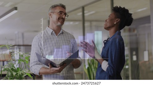 Image of data processing over diverse business people in office. Global business and digital interface concept digitally generated image.