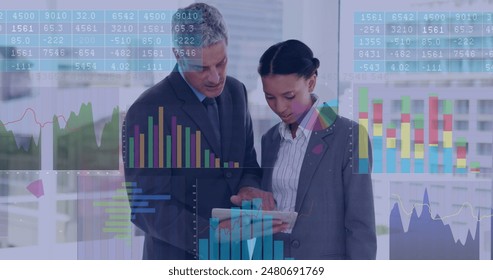 Image of data processing over diverse businessman and businesswoman discussing at office. Computer interface and business data technology concept