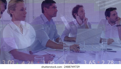 Image of data processing over diverse business people at meeting. Global business and digital interface concept digitally generated image.
