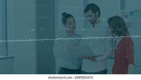 Image of data processing over diverse business people in office. Global business and digital interface concept digitally generated image.