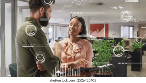 Image of data processing over diverse business people in office. Global computing, digital interface and data processing concept digitally generated image.