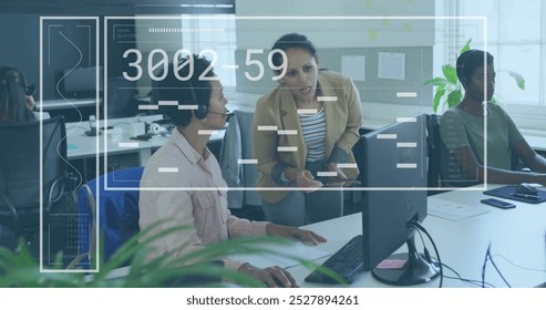 Image of data processing over diverse female colleagues discussing work in office. Global business, finances, communication, and digital interface concept digitally generated image.