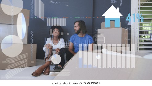 Image of data processing over diverse couple moving house. Global business and digital interface concept digitally generated image. - Powered by Shutterstock