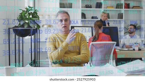 Image of data processing over diverse business people in office. Global business, finances and digital interface concept digitally generated image.