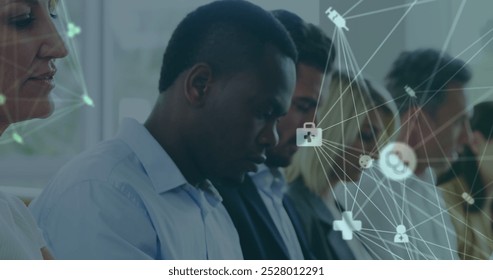 Image of data processing over diverse business people at meeting. Global business and digital interface concept digitally generated image.