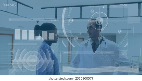Image of data processing over diverse doctors at hospital. Global medicine, healthcare and digital interface concept digitally generated image.