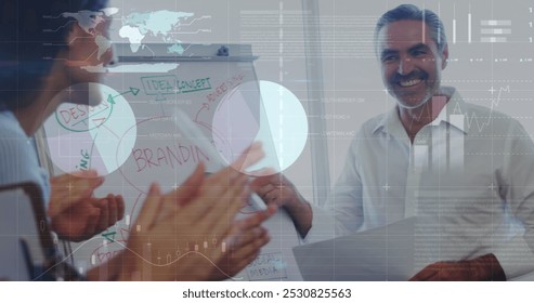 Image of data processing over diverse business people discussing work. Global business and digital interface concept digitally generated image.