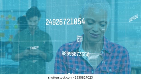 Image of data processing over diverse business people in office. Global business and digital interface concept digitally generated image.