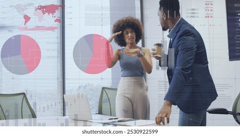 Image of data processing over diverse business people working at office. Global business and digital interface concept digitally generated image.