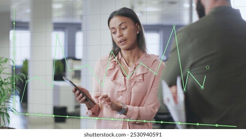 Image of data processing over diverse business people in office. Global business and digital interface concept digitally generated image.