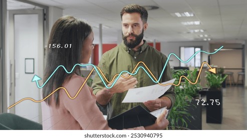 Image of data processing over diverse business people in office. Global business and digital interface concept digitally generated image.