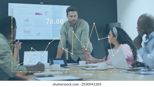 Image of data processing over diverse business people working in office. Global business and digital interface concept digitally generated image.