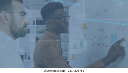 Image of data processing over diverse business people taking notes. global business, finances, connections and digital interface concept digitally generated image.