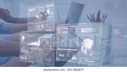 Image of data processing over diverse business people using laptops. global business and digital interface concept digitally generated image.