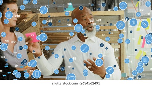 Image of data processing over diverse business people taking notes. Global business and digital interface concept digitally generated image. - Powered by Shutterstock - Get 15% off with code: PIKWIZARD15
