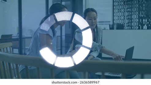 Image of data processing over diverse business people talking in office. Global business and digital interface concept digitally generated image.