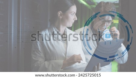 Image of data processing over diverse workers in server room. Global business and digital interface concept digitally generated image.