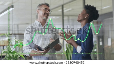 Image of data processing over diverse business people in office. Global business and digital interface concept digitally generated image.
