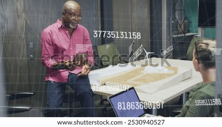 Image of data processing over diverse business people in office. Global business and digital interface concept digitally generated image.