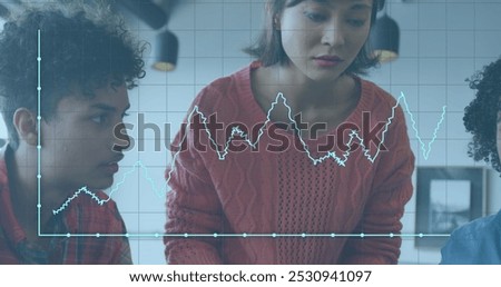 Image of data processing over diverse business people in office. Global business and digital interface concept digitally generated image.