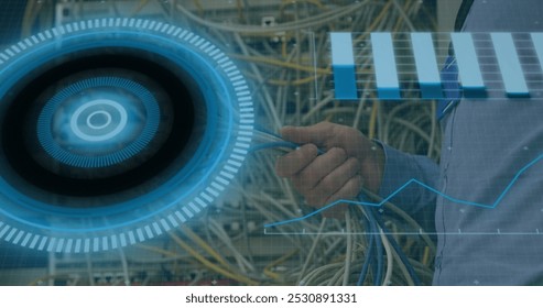 Image of data processing over hands of caucasian male engineer connecting wires. computers, network, data processing, technology and digital interface concept digitally generated image.