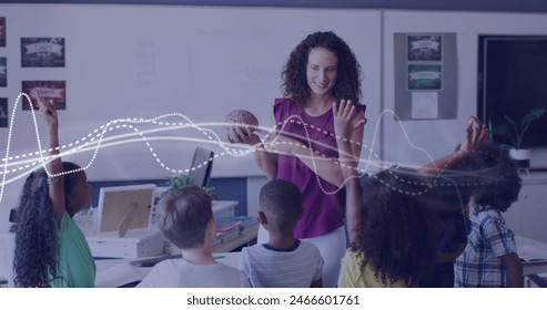 Image of data processing over happy diverse female teacher showing brain model to pupils. Science, biology, school, childhood, education and learning, digitally generated image. - Powered by Shutterstock