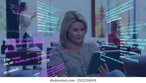 Image of data processing over happy caucasian businesswoman using tablet at office. Business, data, network, digital interface and communication, digitally generated image.
