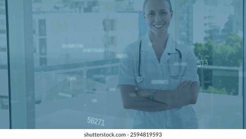 Image of data processing over happy cauasian female doctor with arms crossed. Global medicine and digital interface concept digitally generated image.