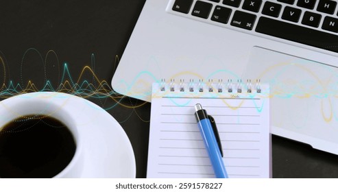 Image of data processing over laptop and notebook on desk. Global finance, business, connections, computing and data processing concept digitally generated image.