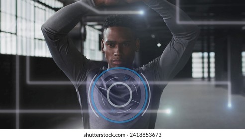 Image of data processing over man stretching, exercising in gym. Digital interface global sport and performance concept digitally generated image.